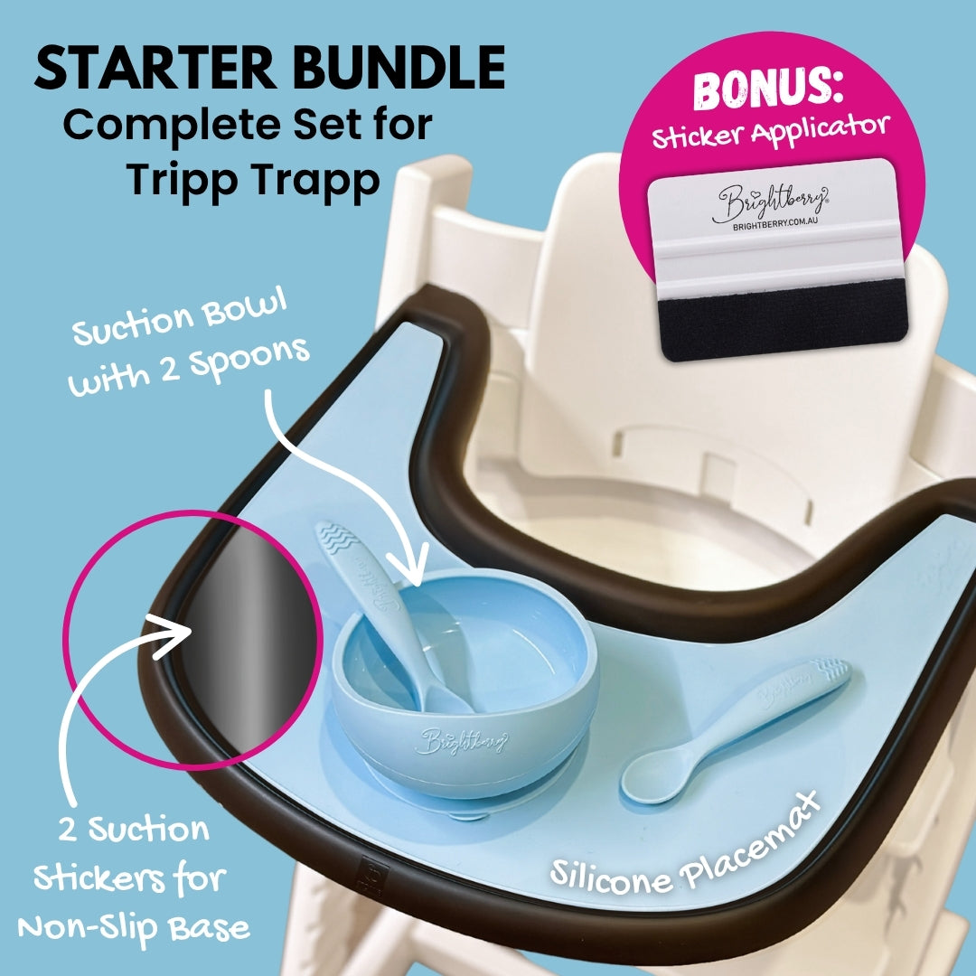 Brightberry Starter Bundle for Stokke Tripp Trapp featuring a suction bowl with two spoons, a silicone placemat, two suction stickers for a non-slip base, and a bonus sticker applicator, displayed on a high chair tray.
